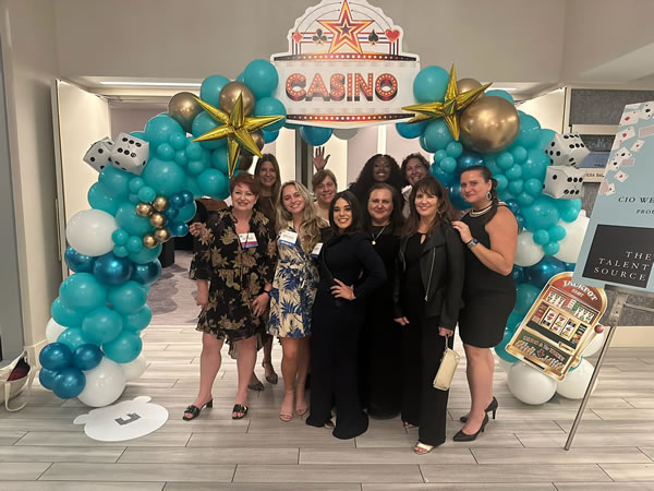 ITWomen-Balloon Group Pic-v2 2023 ITWomen volunteers celebrate return of signature fundraiser Celebrity CIO Texas Hold'em Tournament & Casino night for Engineering and Tech scholarships for girls.